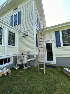 Residential air conditioning being installed