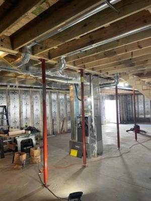 New furnace and duct work in the basement of a new home